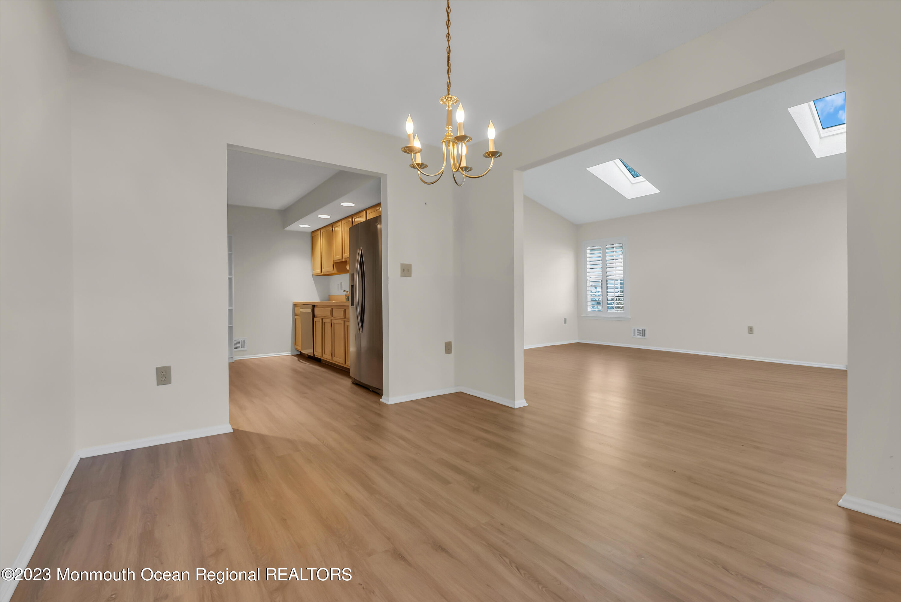 25 Cottontail Drive Brick, NJ 08724 - Photo 11 of 32 a view of an empty room with window and wooden floor
