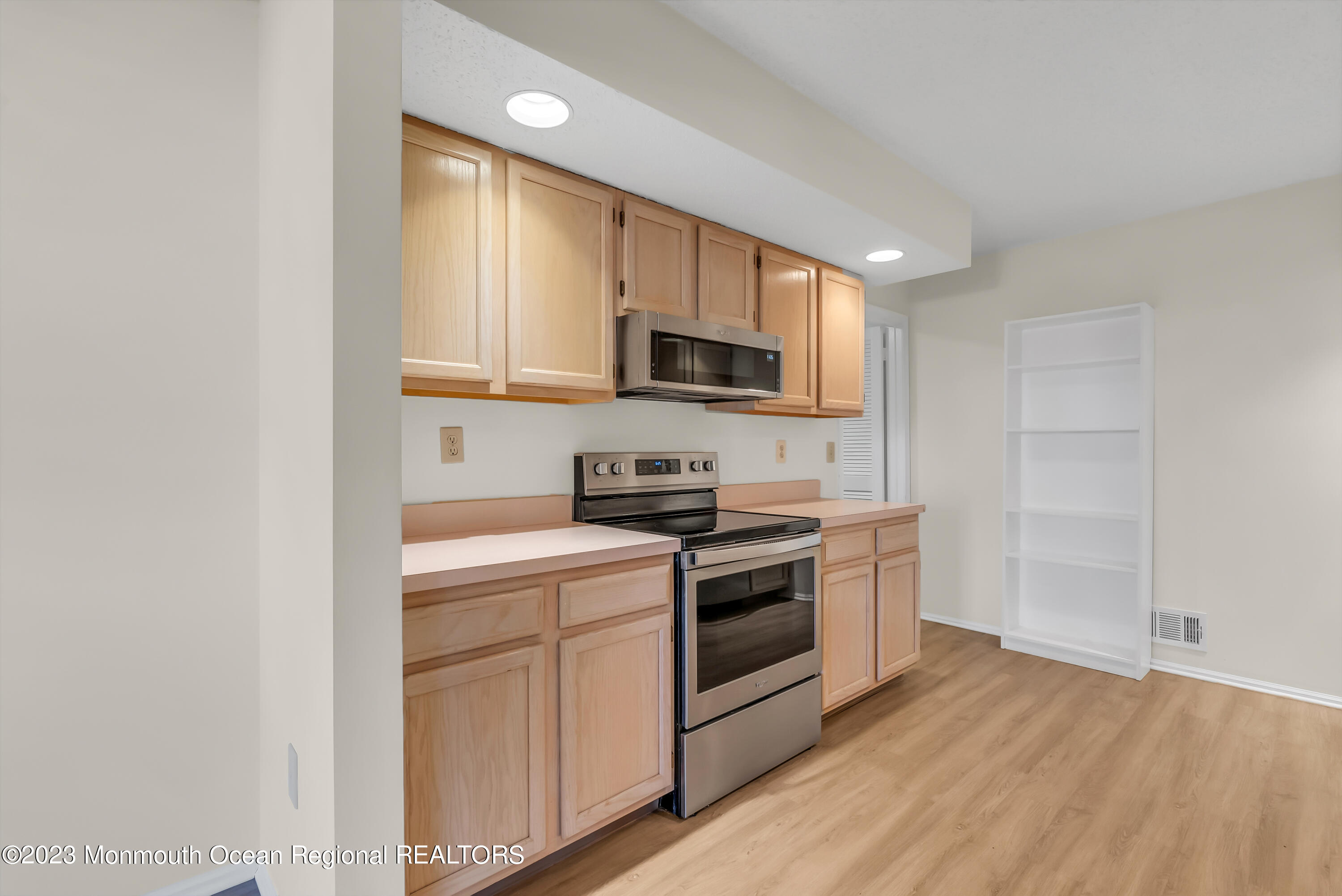 25 Cottontail Drive Brick, NJ 08724 - Photo 13 of 32 a kitchen with a stove a sink and a microwave
