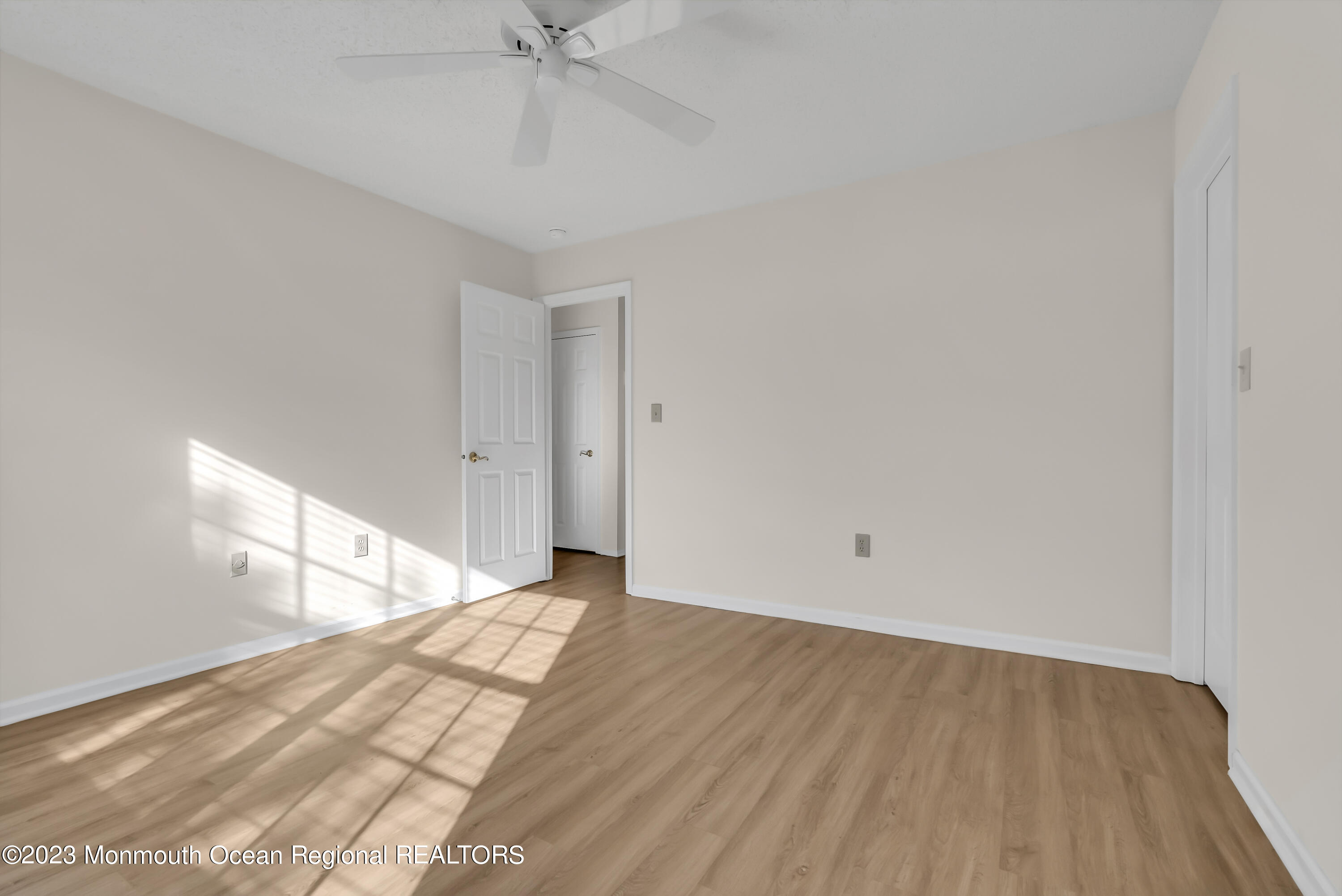 25 Cottontail Drive Brick, NJ 08724 - Photo 18 of 32 a view of an empty room and wooden floor