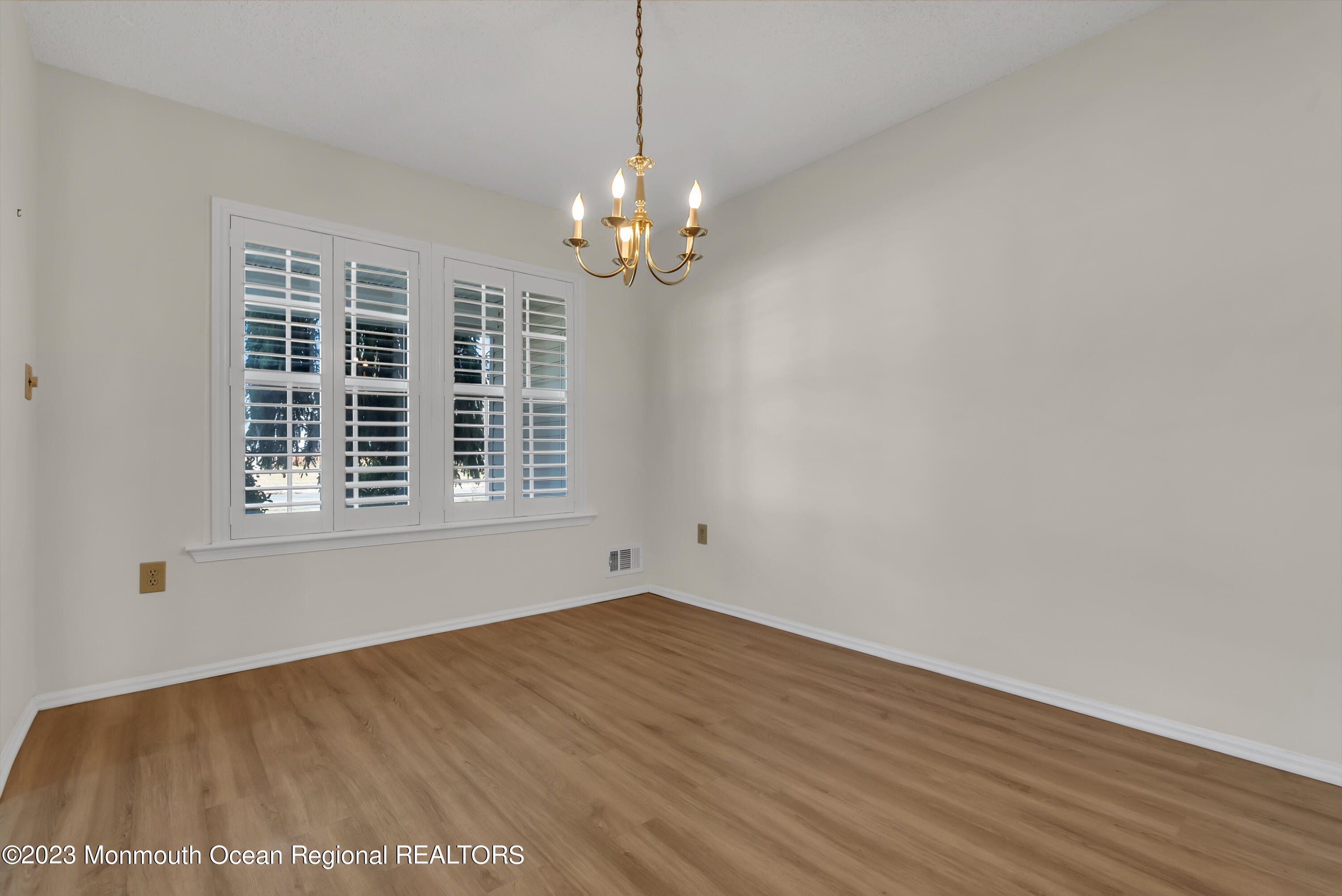 25 Cottontail Drive Brick, NJ 08724 - Photo 10 of 32 a view of wooden floor in an empty room