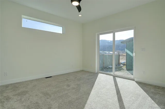 an empty room with glass door