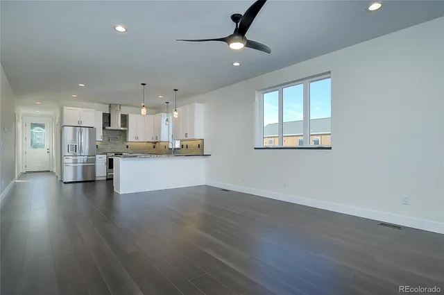 a view of kitchen with wooden floor and window