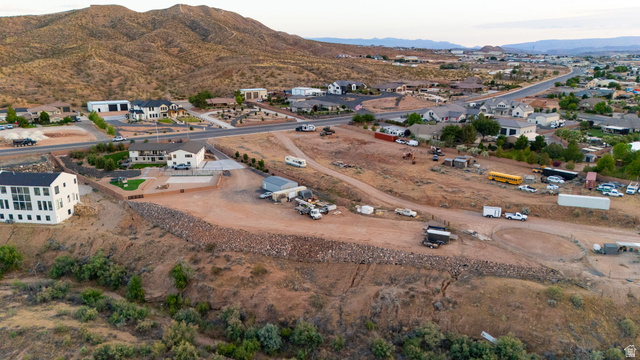 2591 East Washington Dam Road Washington, UT 84780 - Photo 3 of 67 Expansive elevated parcel featuring a significant flat pad, existing hardscaping, and a retaining wall