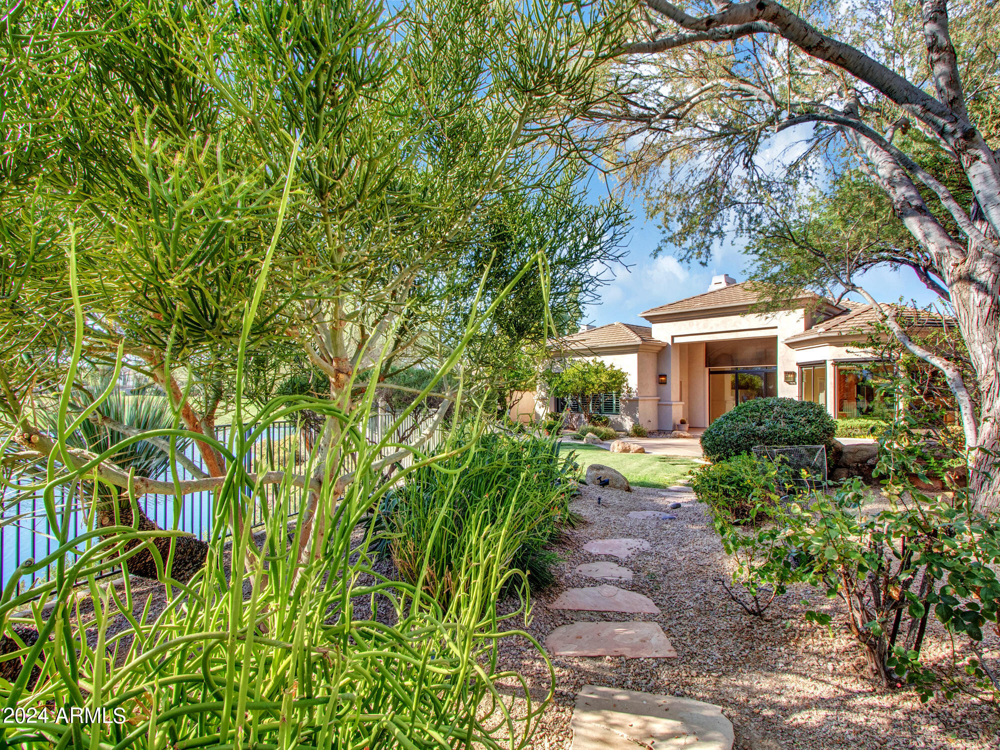 7375 East Gainey Ranch Road, Unit 2 Scottsdale, AZ 85258 - Photo 22 of 79 Backyard pathway