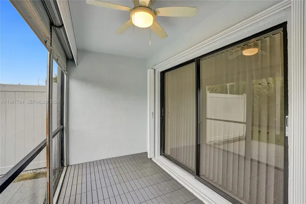 a view of a room with wooden floor and iron gate