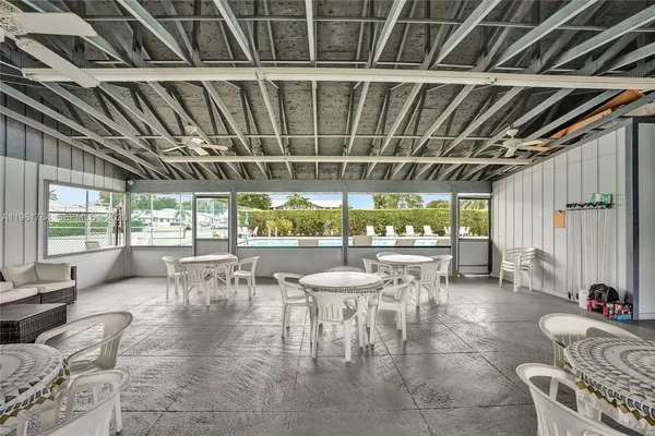 a view of swimming pool with seating area
