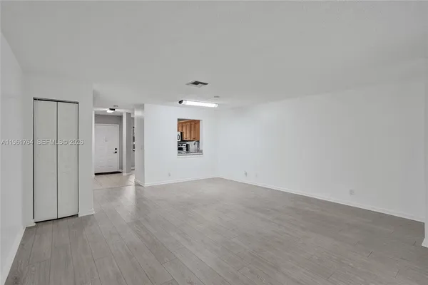 a view of an empty room with a window
