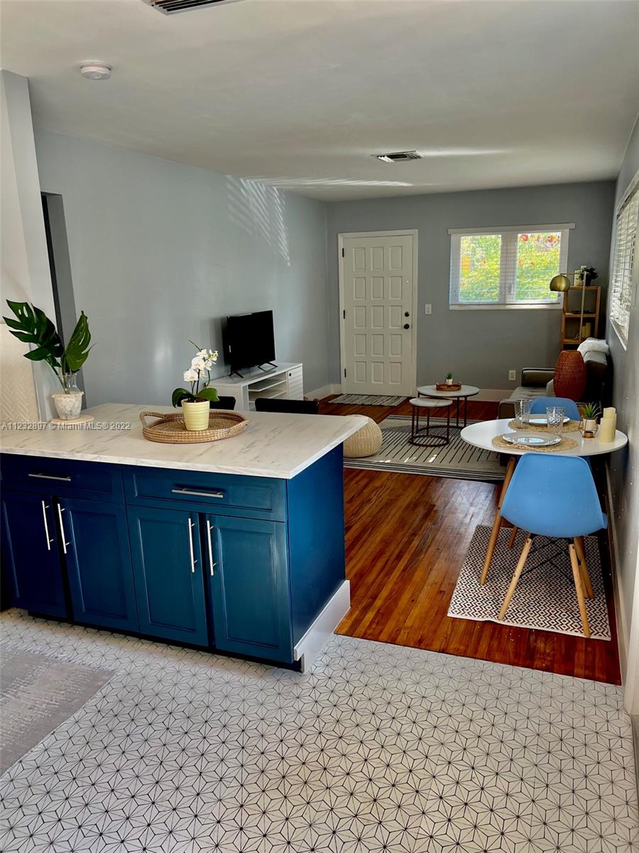3095 Southwest 21st Street, Unit 1 Miami, FL 33145 - Photo 2 of 15 a room with furniture and a potted plant