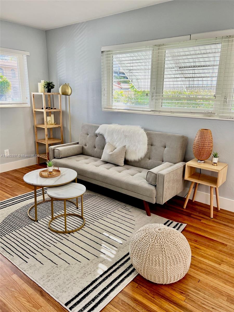3095 Southwest 21st Street, Unit 1 Miami, FL 33145 - Photo 4 of 15 a living room with furniture and a wooden floor