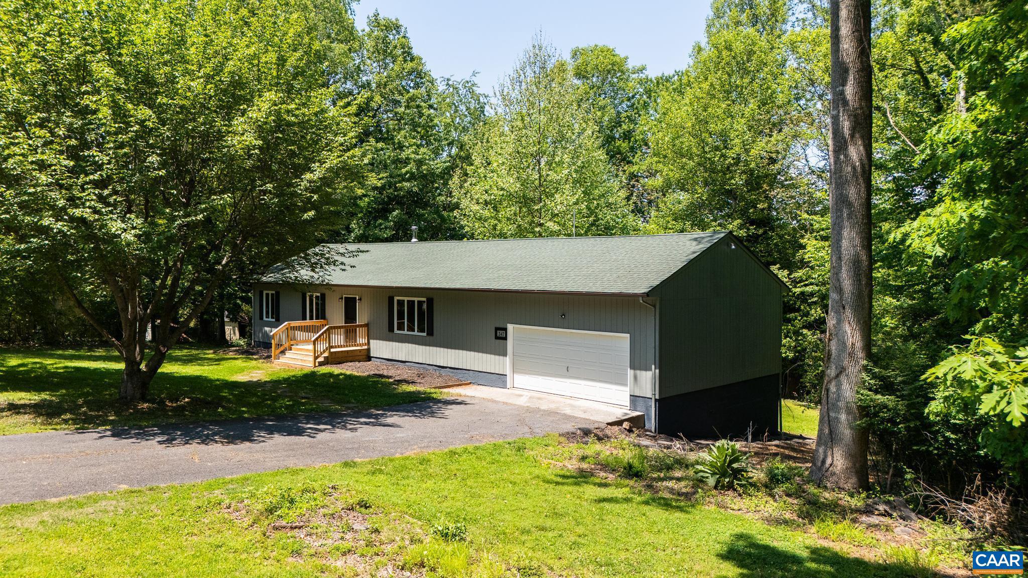 247 Goldenrod Road Ruckersville, VA 22968 - Photo 1 of 35 a view of a house with backyard and sitting area