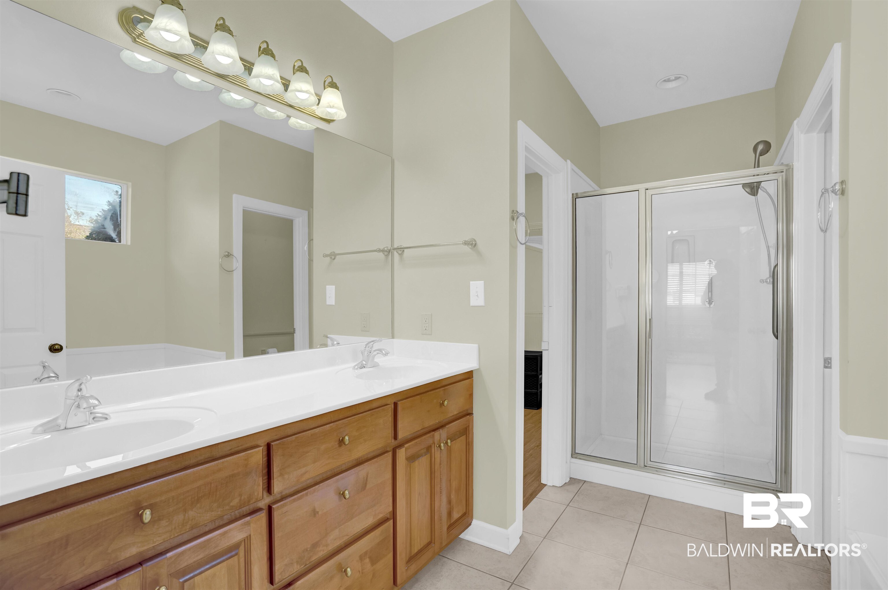 100 Conti Court Fairhope, AL 36532 - Photo 35 of 54 Bathroom with tile patterned flooring, vanity, and a shower with shower door