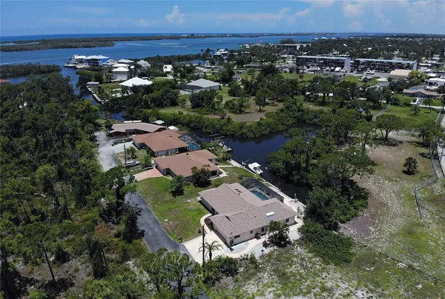 a aerial view of a house with swimming pool and garden