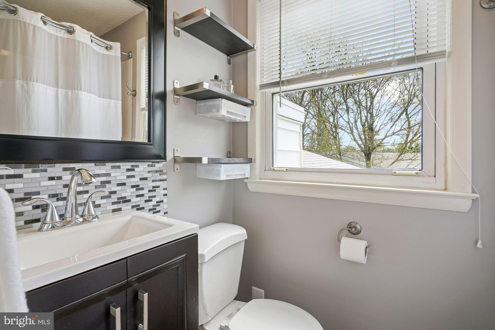 6111 Pinto Place Springfield, VA 22150 - Photo 18 of 35 Primary bath with upgraded tile, vanity, paint
