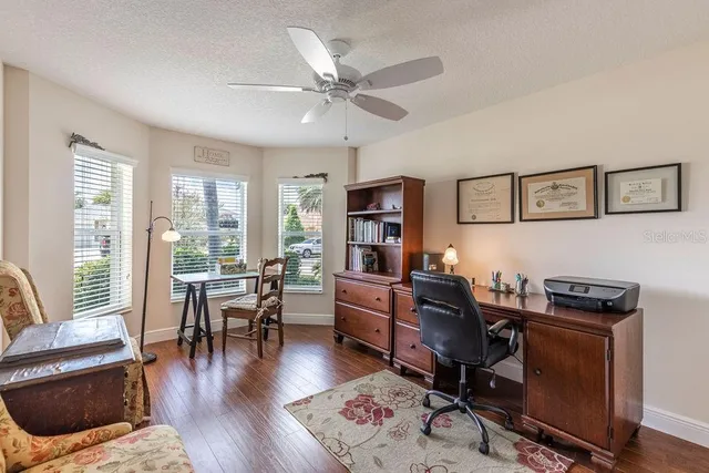 a view of a workspace with furniture and a livingroom
