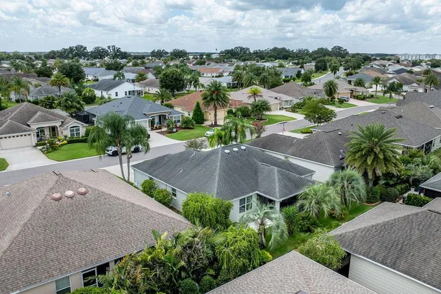 an aerial view of a house with yard and street view
