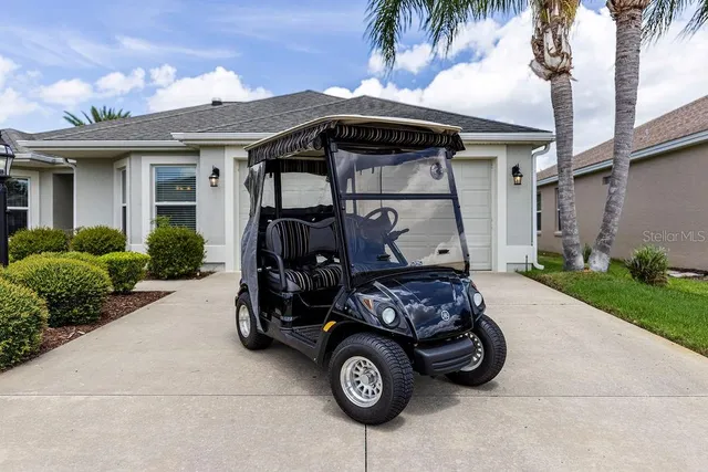 a front view of a house with parking space