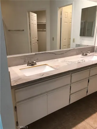 a view of closet with wooden floor