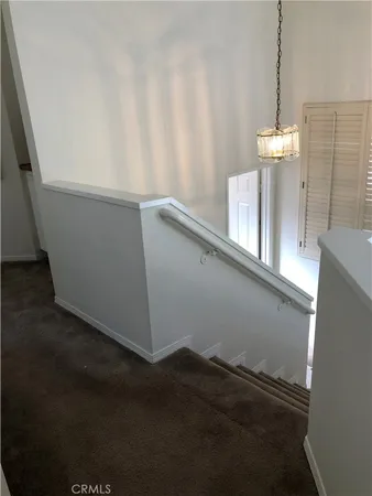a view of storage and utility room with window