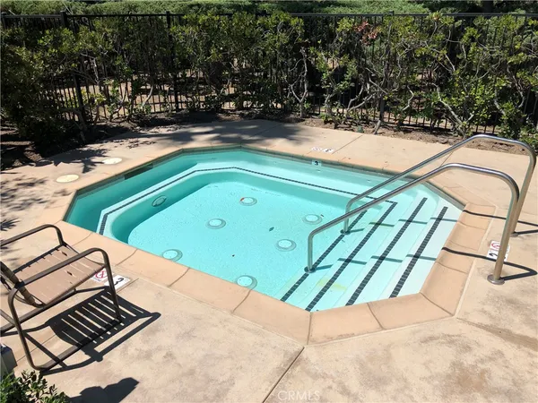 a view of a swimming pool with a yard