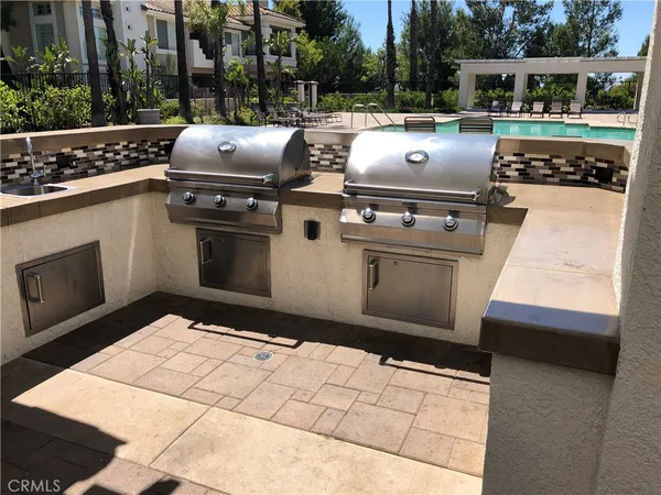 a view of kitchen with stove and microwave