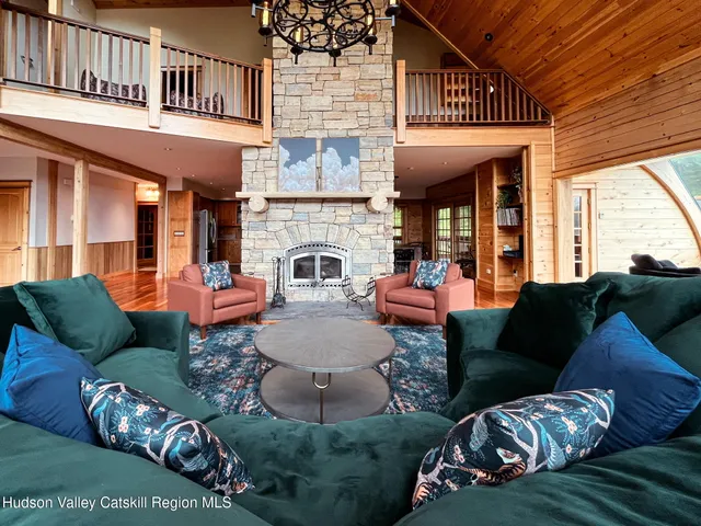 a view of a patio with couches chairs and a fire pit