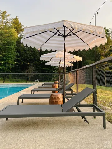 a view of a yard with wooden deck