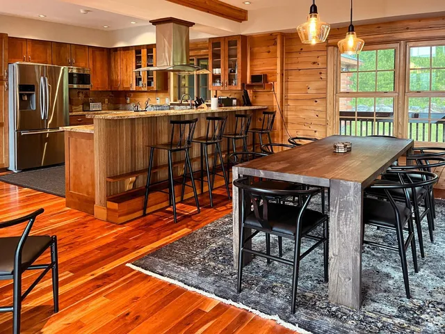 a kitchen with stainless steel appliances granite countertop a stove and a refrigerator