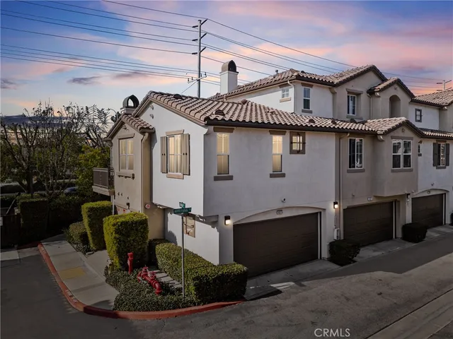 a view of a big house with many windows
