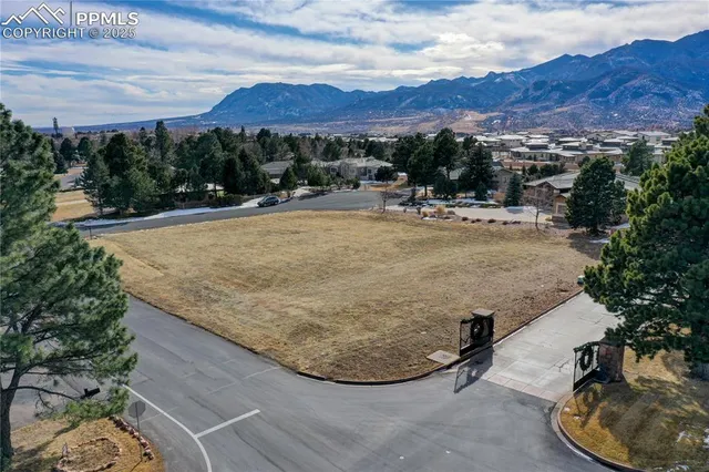 an aerial view of residential houses and outdoor space