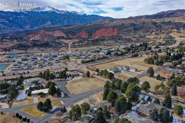 an aerial view of residential house and sandy dunes