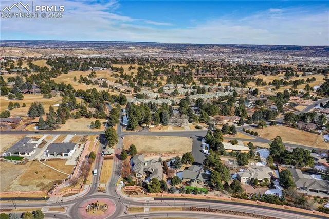 an aerial view of residential building with parking space