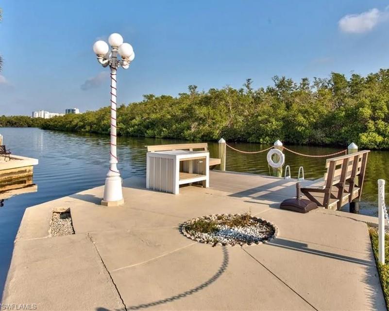 777 Walkerbilt Road, Unit 9 Naples, FL 34110 - Photo 16 of 17 swimming pool view with a seating space