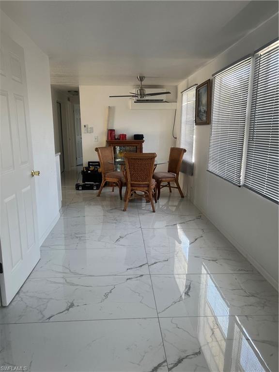 777 Walkerbilt Road, Unit 9 Naples, FL 34110 - Photo 6 of 17 a living room with furniture and a window