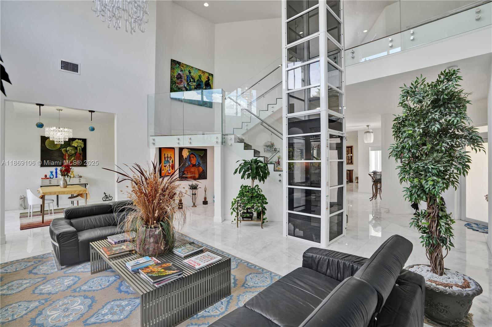 2691 Southwest 139th Terrace Davie, FL 33330 - Photo 12 of 55 a living room with furniture potted plant and a window