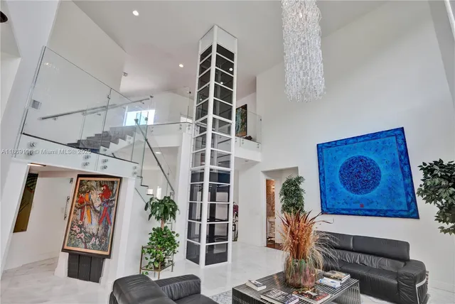 view of living room with furniture and a large window
