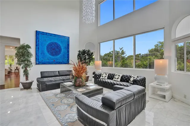 a view of a living room and entryway