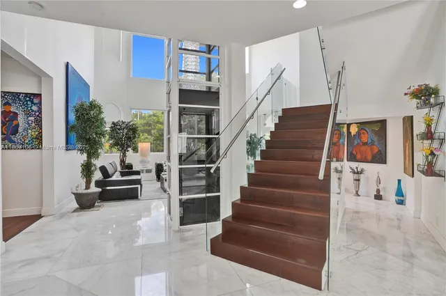 a kitchen with a sink a stove and chairs