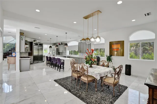 a bedroom with furniture and a wooden floor