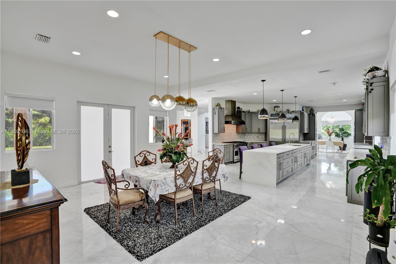 2691 Southwest 139th Terrace Davie, FL 33330 - Photo 30 of 55 a living room with furniture and a chandelier