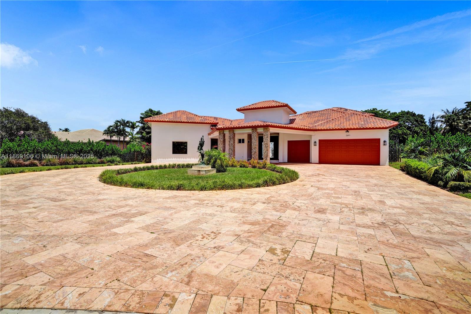 2691 Southwest 139th Terrace Davie, FL 33330 - Photo 3 of 55 a front view of a house with a yard