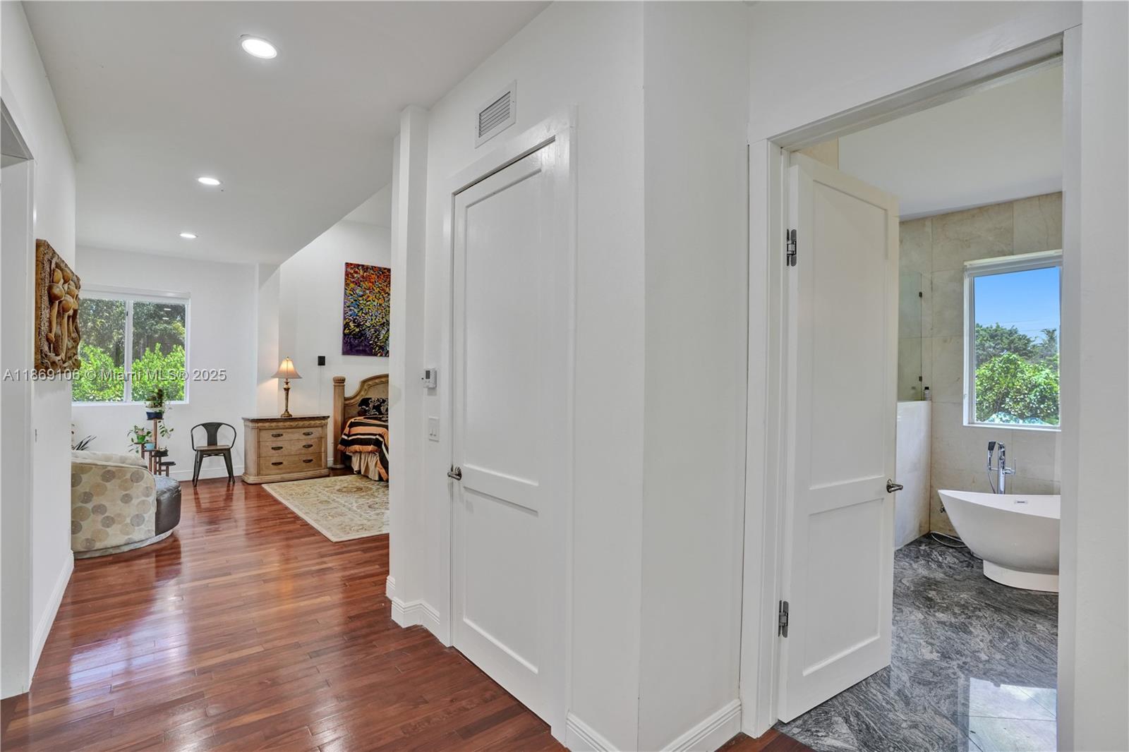 2691 Southwest 139th Terrace Davie, FL 33330 - Photo 31 of 55 a view of a living room kitchen and a wooden floor