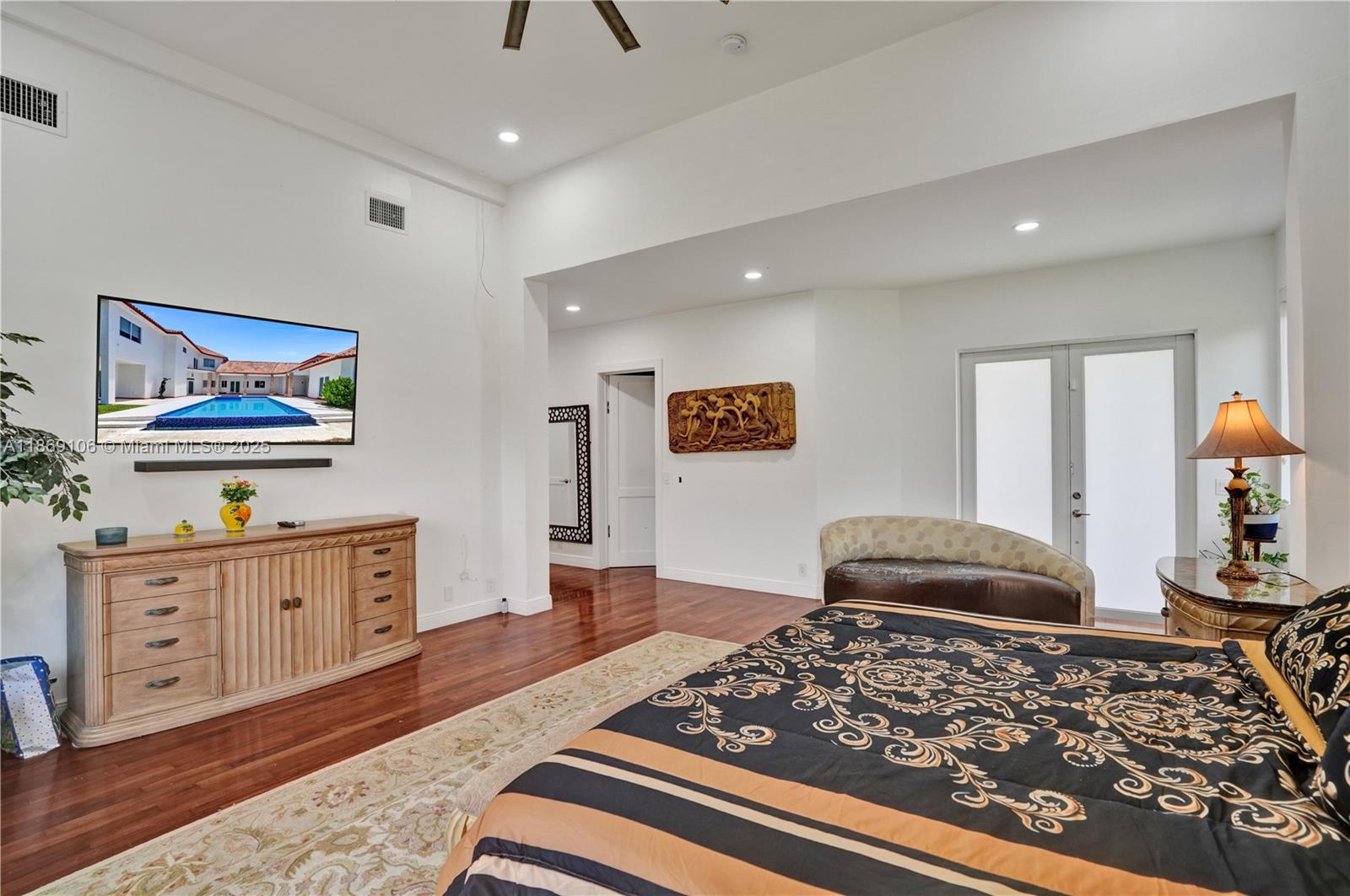 2691 Southwest 139th Terrace Davie, FL 33330 - Photo 33 of 55 a bedroom with furniture and a wooden floor