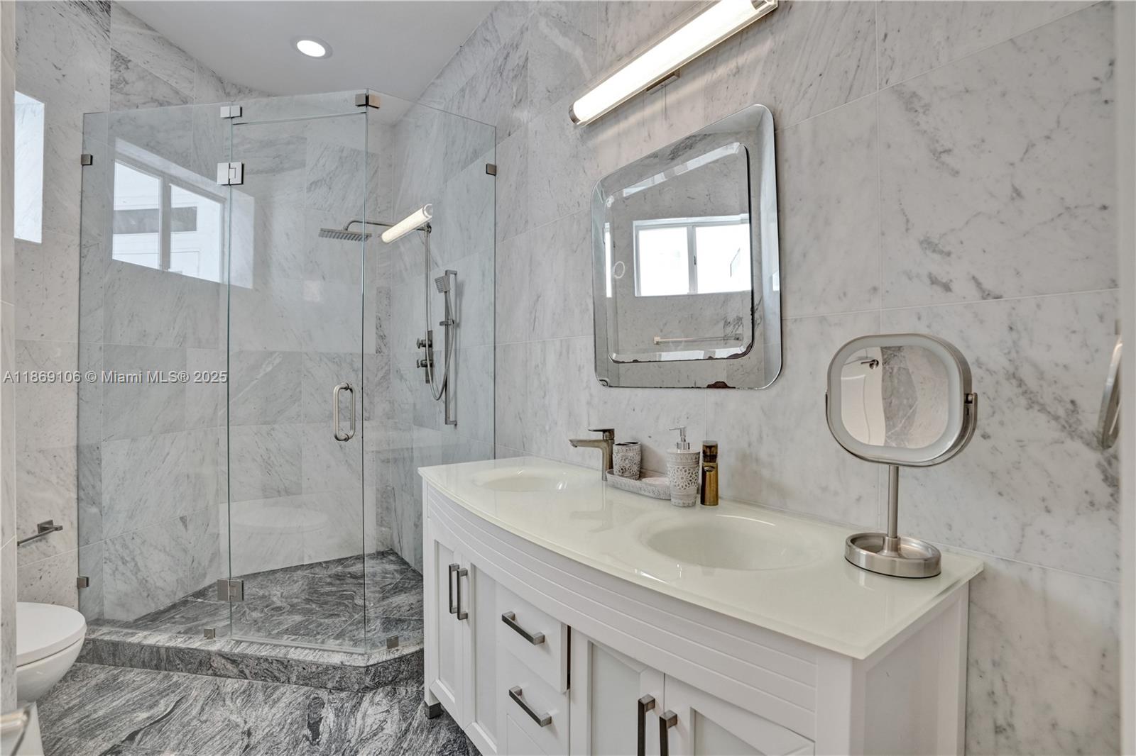 2691 Southwest 139th Terrace Davie, FL 33330 - Photo 35 of 55 a bathroom with a sink a toilet and shower