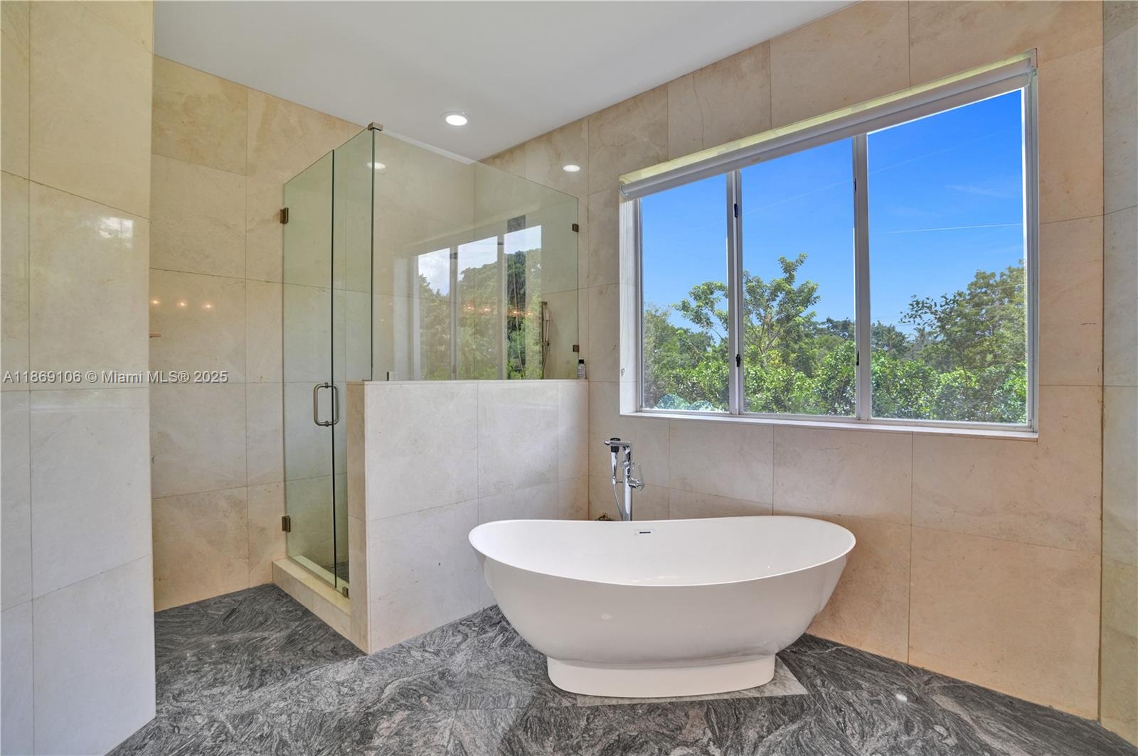 2691 Southwest 139th Terrace Davie, FL 33330 - Photo 36 of 55 a bathroom with a bathtub and a shower