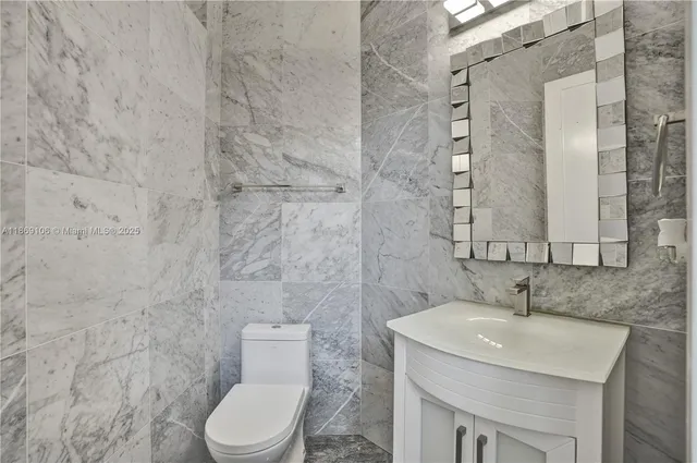 a view of empty room with wooden floor and windows