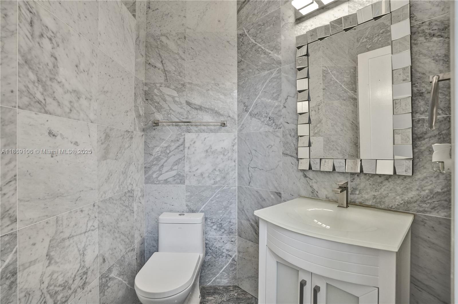 2691 Southwest 139th Terrace Davie, FL 33330 - Photo 37 of 55 a bathroom with a sink a toilet and shower