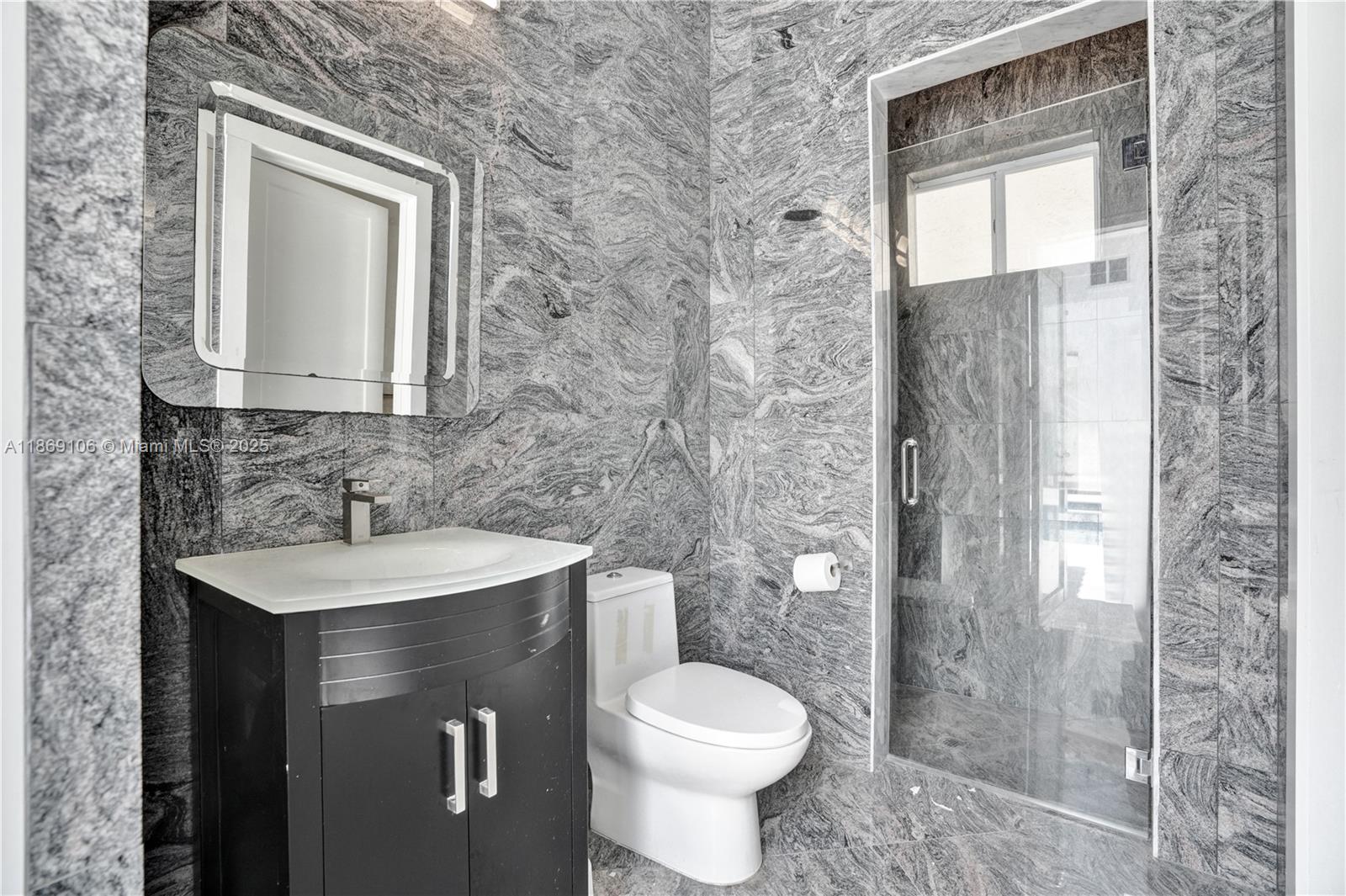 2691 Southwest 139th Terrace Davie, FL 33330 - Photo 38 of 55 a bathroom with a sink toilet and shower