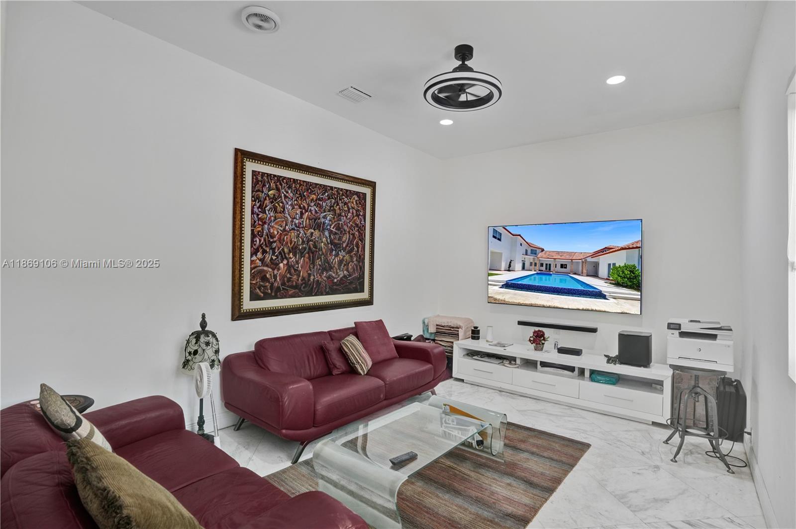 2691 Southwest 139th Terrace Davie, FL 33330 - Photo 39 of 55 a living room with furniture and a flat screen tv