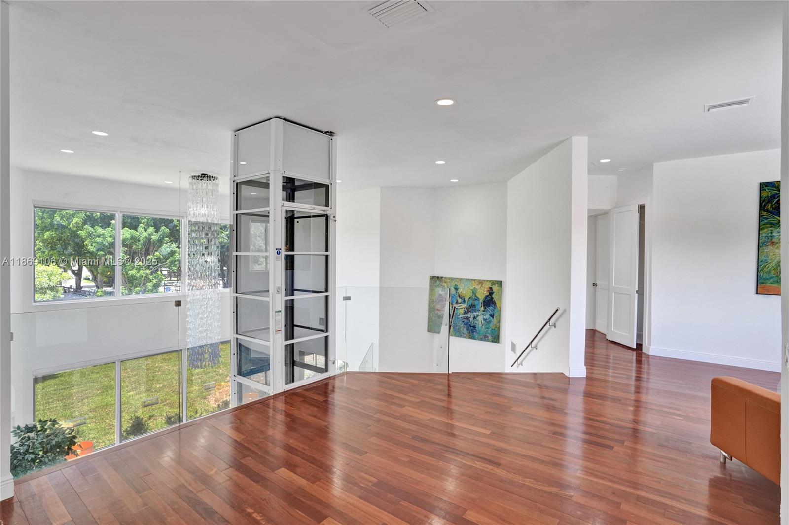 2691 Southwest 139th Terrace Davie, FL 33330 - Photo 41 of 55 a view of empty room with wooden floor and windows