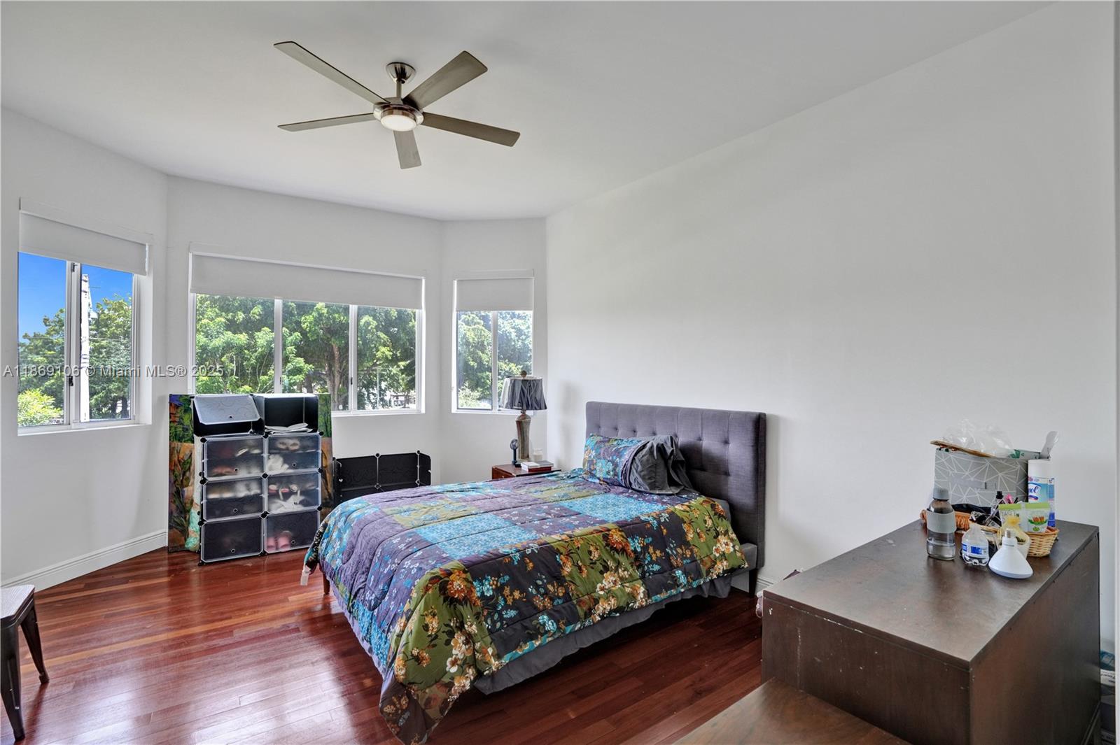 2691 Southwest 139th Terrace Davie, FL 33330 - Photo 42 of 55 a bedroom with a bed and a table